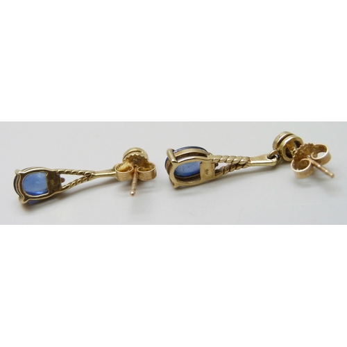 7035 - A pair of 9ct gold drop earrings set with cabochon blue stones, 2.1g, 2.2cm drop