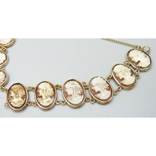 7040 - A 9ct gold mounted cameo panel bracelet, 14.7g total weight