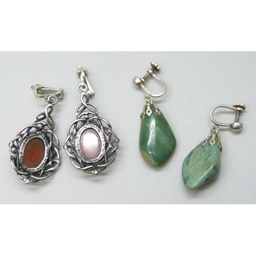 7043 - A pair of silver and amber earrings, and a green stone example on plated screw backs