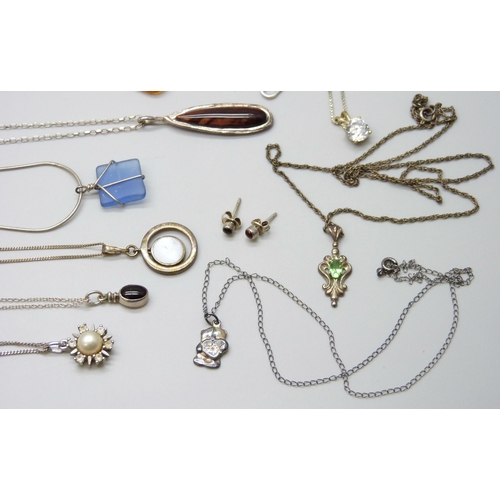 7046 - A collection of silver and white metal chains, pendants and a bracelet