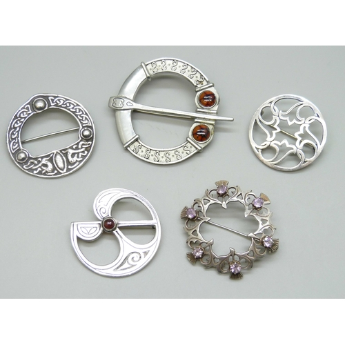 7048 - Five Scottish and Celtic brooches, four hallmarked silver, 34g, and one larger metal example