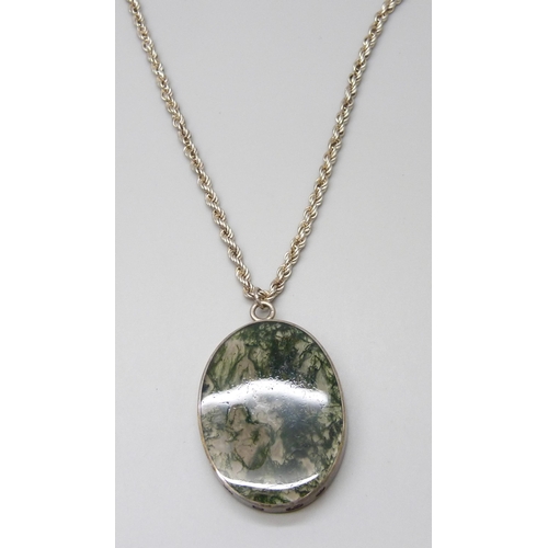 7051 - A large moss agate silver framed pendant on a silver chain, 55g