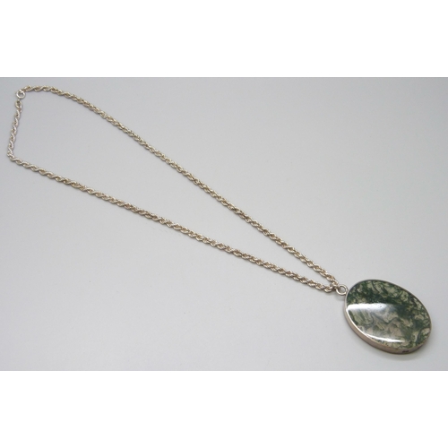 7051 - A large moss agate silver framed pendant on a silver chain, 55g