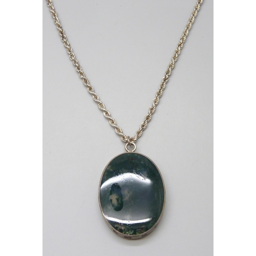 7051 - A large moss agate silver framed pendant on a silver chain, 55g