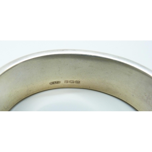 7052 - A vintage engraved silver bangle, lacking safety clasp, Birmingham 1946, 28g