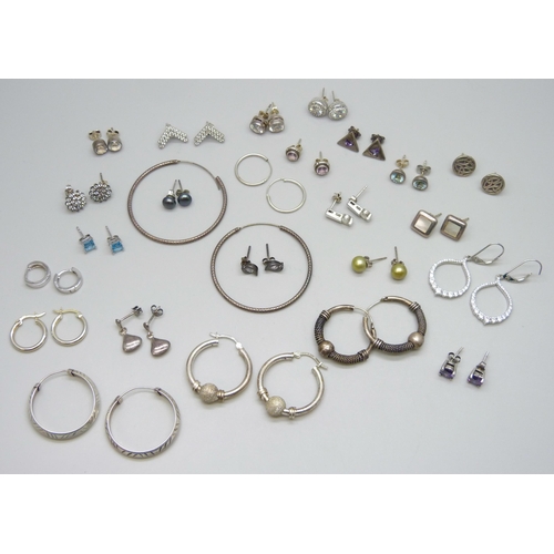 7061 - A collection of 25 pairs of silver and white metal earrings