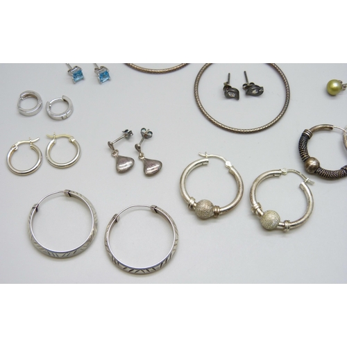 7061 - A collection of 25 pairs of silver and white metal earrings