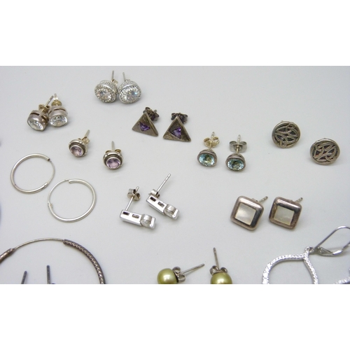 7061 - A collection of 25 pairs of silver and white metal earrings