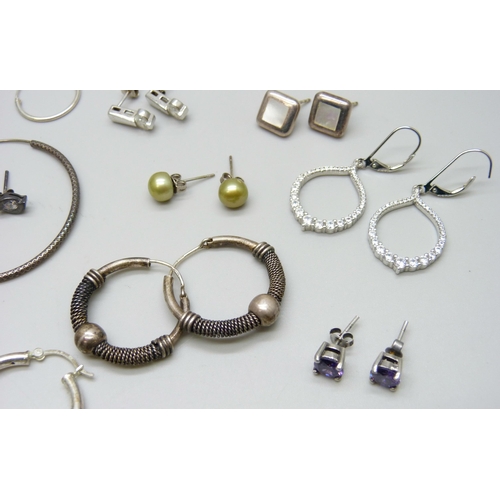 7061 - A collection of 25 pairs of silver and white metal earrings