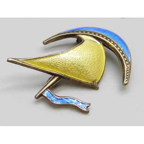 7066 - A Norwegian silver and yellow guilloche enamel brooch by Karl Rasmussen, 6.5cm, together with anothe... 