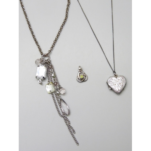 7074 - A silver belcher chain with heart tag, a silver locket and a silver pendant, 15g total, together wit... 