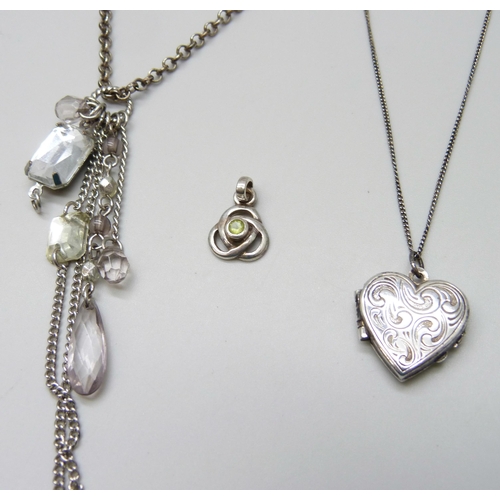 7074 - A silver belcher chain with heart tag, a silver locket and a silver pendant, 15g total, together wit... 