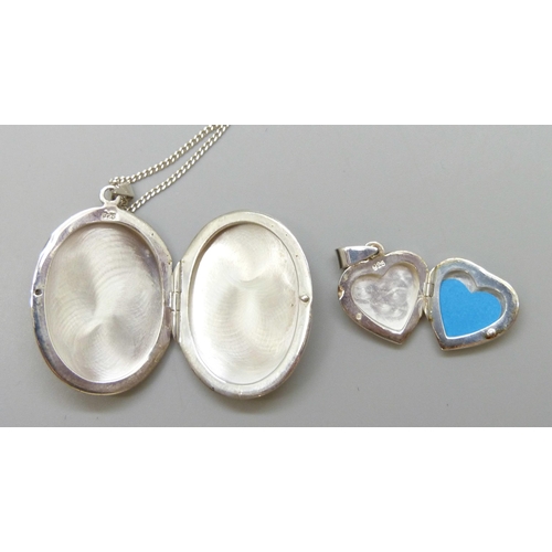 7077 - Two silver lockets and chains and a silver cat pendant, 28g