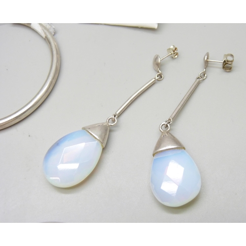 7078 - Three pairs of silver earrings, and a pair of large white metal hoop earrings