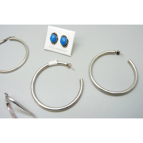 7078 - Three pairs of silver earrings, and a pair of large white metal hoop earrings