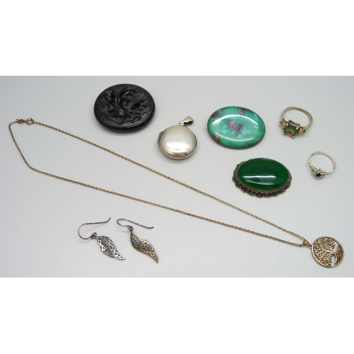 7084 - A collection of silver jewellery including a locket and ring, together with a carved jet brooch, (je... 