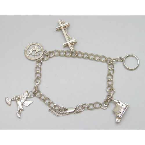 7088 - A sterling silver charm bracelet with charms, 16g