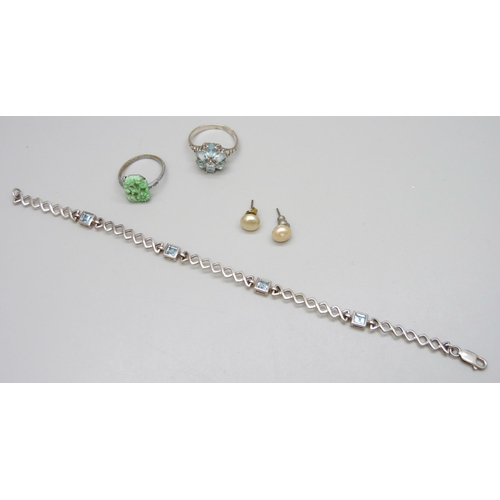 7092 - A silver and topaz bracelet and ring, ring size Q, 11g, together with a costume ring and earrings