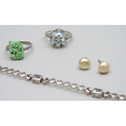 7092 - A silver and topaz bracelet and ring, ring size Q, 11g, together with a costume ring and earrings