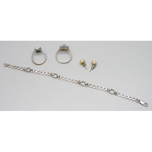 7092 - A silver and topaz bracelet and ring, ring size Q, 11g, together with a costume ring and earrings