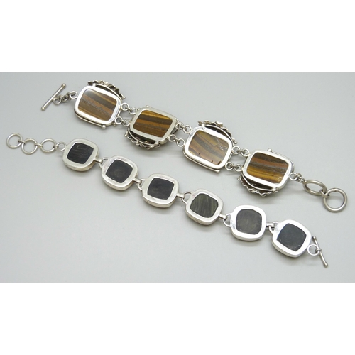 7097 - An Arts & Crafts style silver and tigers eye bracelet, and one other, 109g total