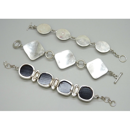 7099 - Three silver bracelets including pearl and foiled glass, 151g