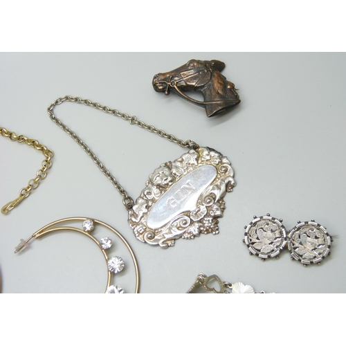 7107 - Two silver brooches, a white metal brooch, a silver bracelet, together with badges, spirit labels, W... 