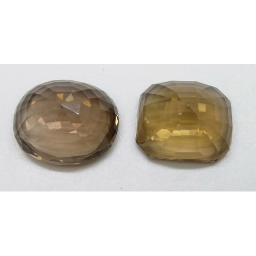 7117 - Two large citrine/smokey quartz, total weight 153 carats