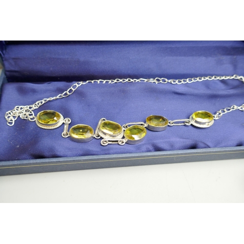 7123 - A collection of silver jewellery, and a plated yellow glass stone necklace