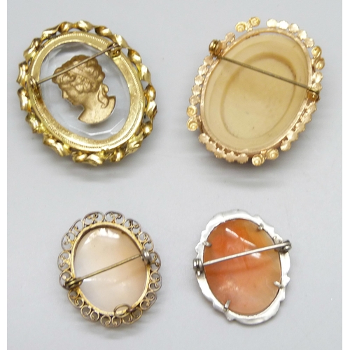 7139 - Four cameo brooches, largest 4.2cm