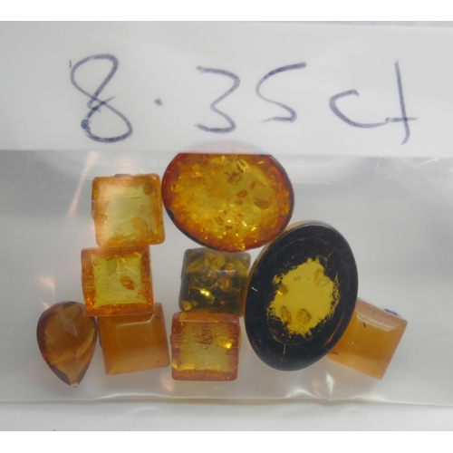 7151 - A collection of citrine gemstones, 79.05ct, and a small quantity of amber, 8.35ct