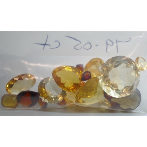 7151 - A collection of citrine gemstones, 79.05ct, and a small quantity of amber, 8.35ct