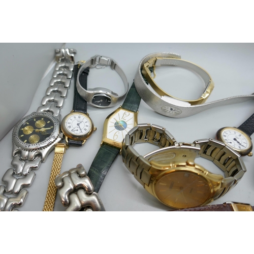 7185 - A collection of 26 wristwatches, and three watch movements including Omega and Garrard