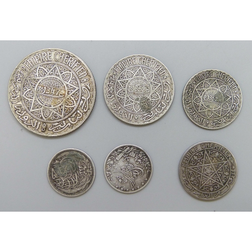 7217 - Three silver Moroccan coins and three Egyptian coins