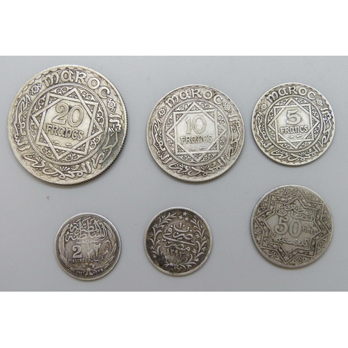 7217 - Three silver Moroccan coins and three Egyptian coins