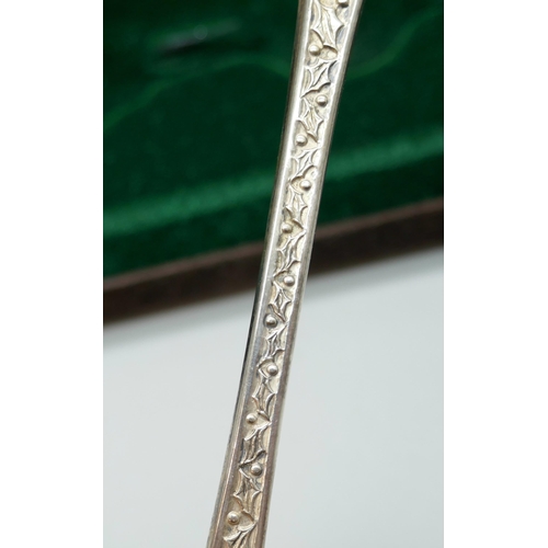 7249 - A silver 1976 John Pinches Christmas spoon, signed Peter Jackson, 28g, cased