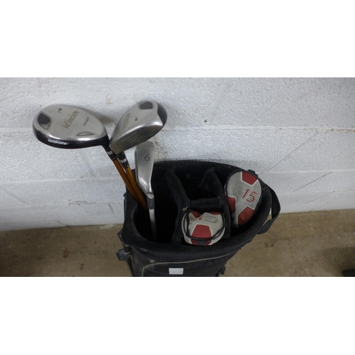 5213 - A Nike golf bag with a Ping Rhapsody recovery wedge and 2 Benross field irons