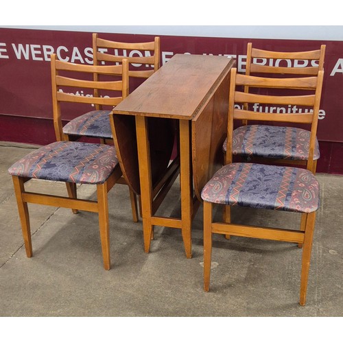 57A - A teak drop leaf table and four chairs