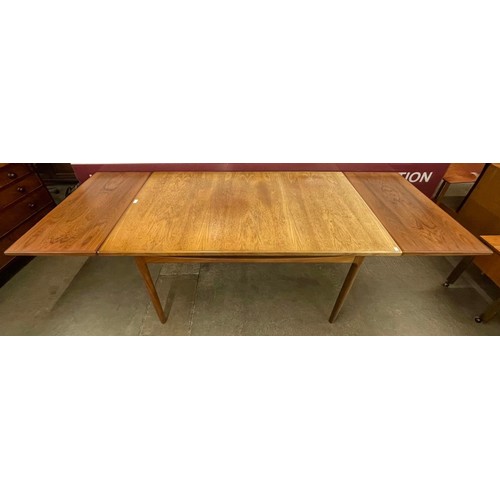 2 - A G-Plan Danish Design teak rectangular extending dining table, designed by Ib Kofod Larsen