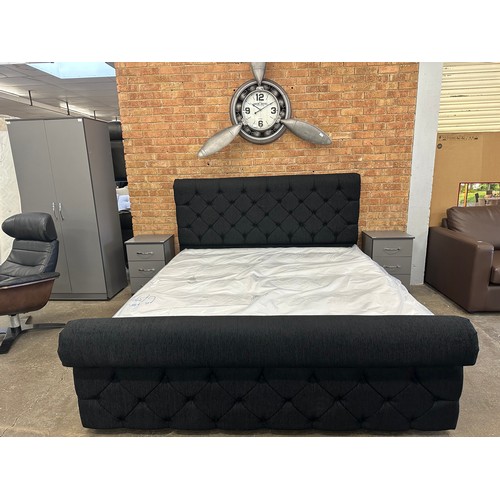 3172 - A black fabric buttoned superking size bed and mattress