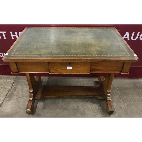 136 - A Victorian walnut and green leather topped double sided library table