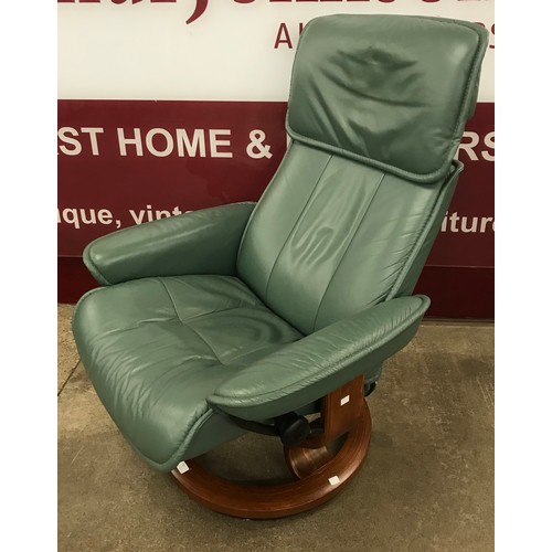 51 - A Norwegian Ekornes beech and green leather Stressless revolving lounge chair