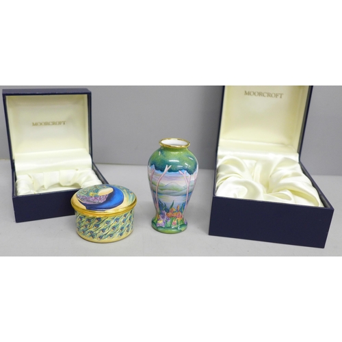 2013 - An enamelled Moorcroft miniature vase with lake scene and a similar pill box with peacock detail, bo... 