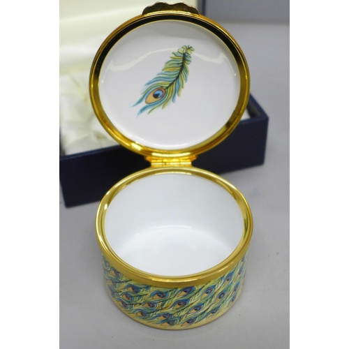 2013 - An enamelled Moorcroft miniature vase with lake scene and a similar pill box with peacock detail, bo... 