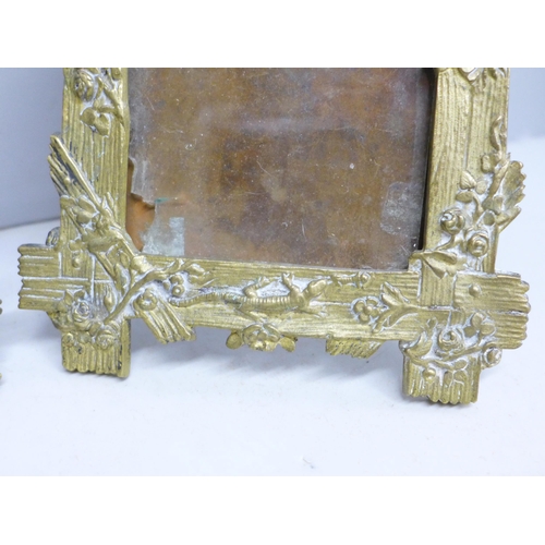 2020 - A pair of brass photograph frames with bird, flowers and lizard detail, circa 1920, possibly French,... 