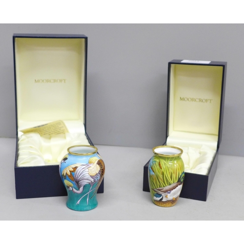 2021 - Two enamelled Moorcroft miniature vases, with mallard and crane detail, boxed