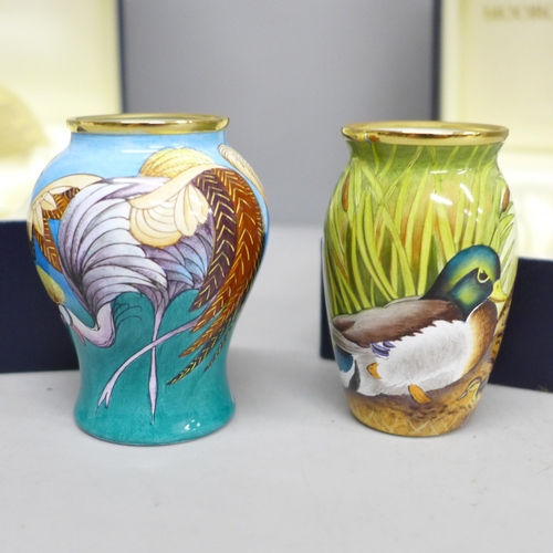 2021 - Two enamelled Moorcroft miniature vases, with mallard and crane detail, boxed