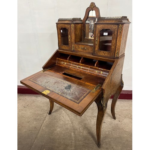 108 - A French Louis XV style walnut and gilt metal mounted bureau de dame