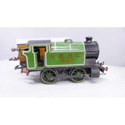 2028 - A Hornby 0 gauge type 101 clockwork locomotive and two coaches