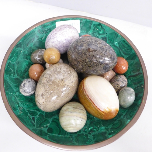 2029 - A collection of egg shaped mineral samples in a malachite bowl